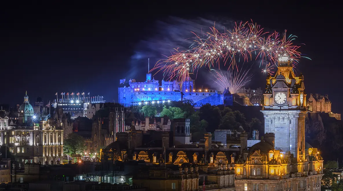 Fireworks over Edinburgh Castle and Balmoral Clock Tower during Hogmanay celebrations